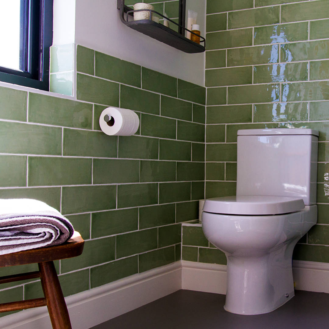 braidwood-road-detail-bathroom Modern bathroom fittings against green metro tiles in a boutique style bathroom in Catford, South London.